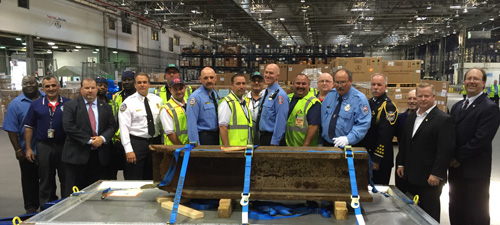 TWU members with piece of steel beam from the World Trade Center